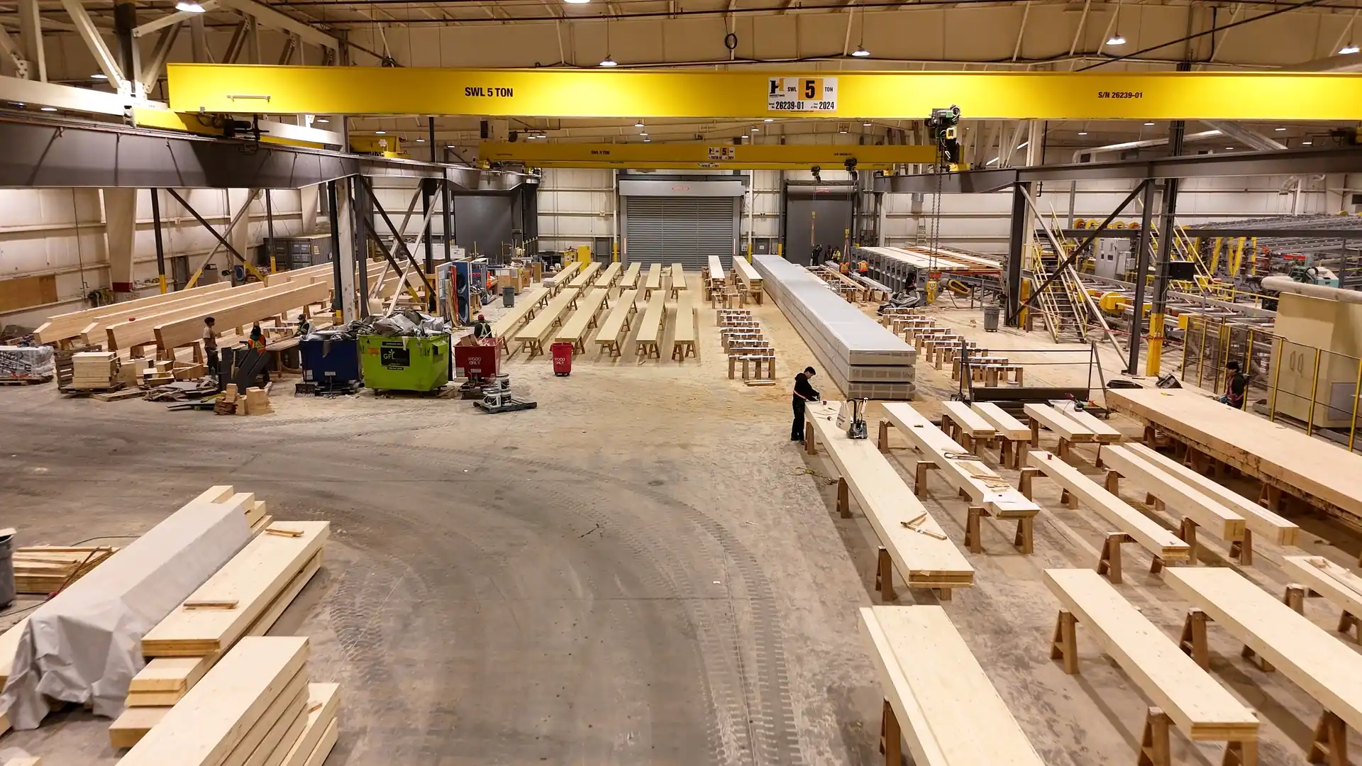 Finished glulam beams on the floor of the new manufacturing facility